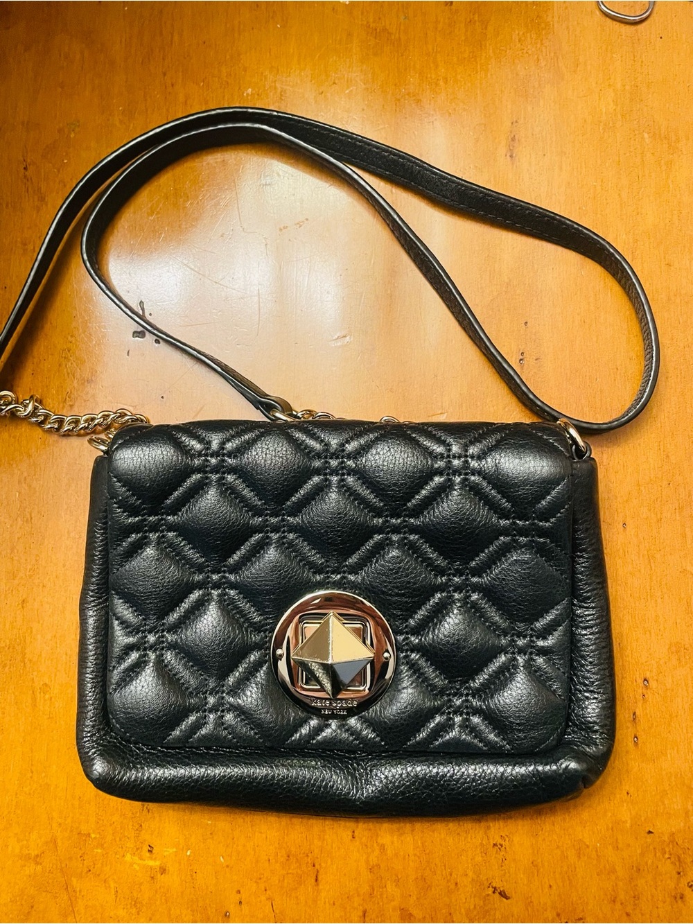 Kate spade Quilted Black Crossbody Bag with Gold Medallion Accent